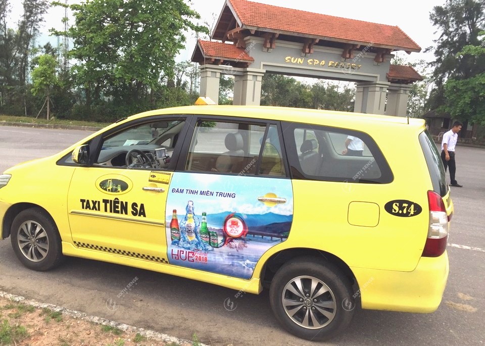 quảng cáo trên xe taxi ở Quảng Bình